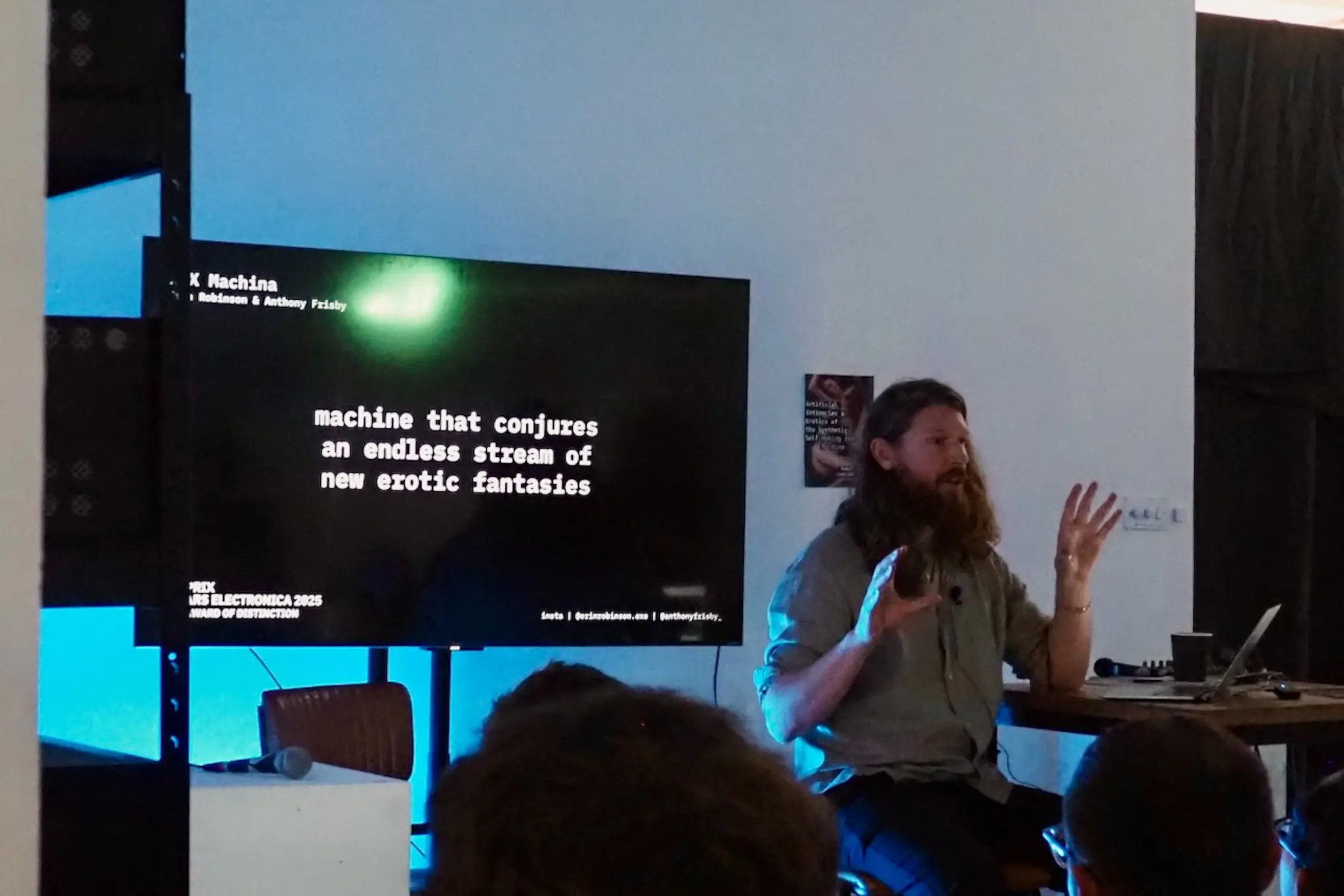 Speaker presenting text on screen at Copeland Gallery