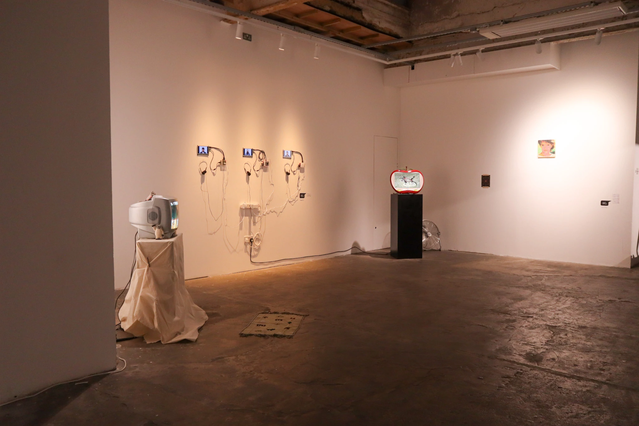 Wide shot of a gallery with art installations