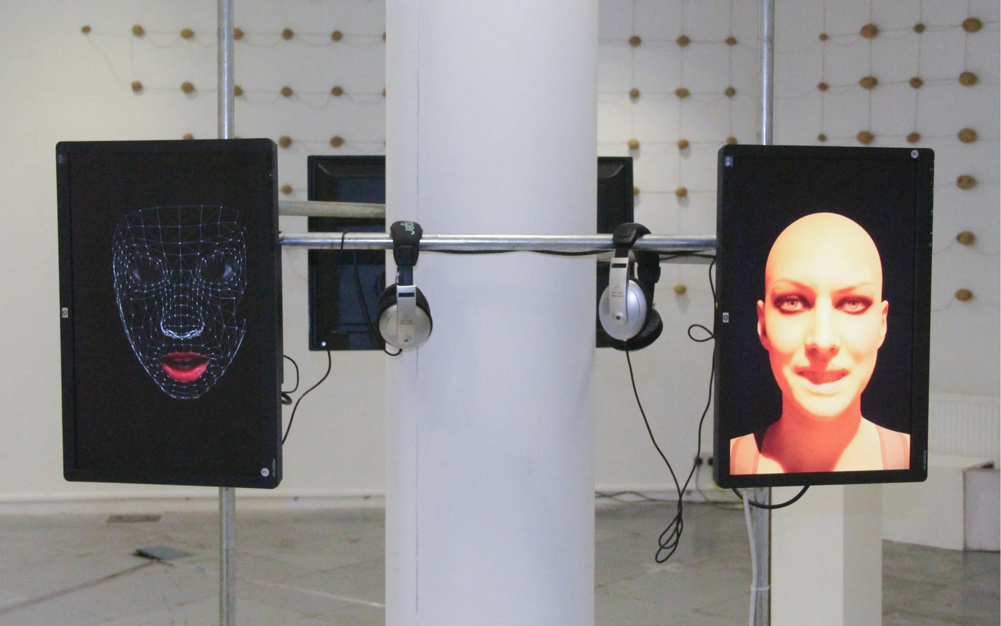 A screen held with metal bars, showing erotic material