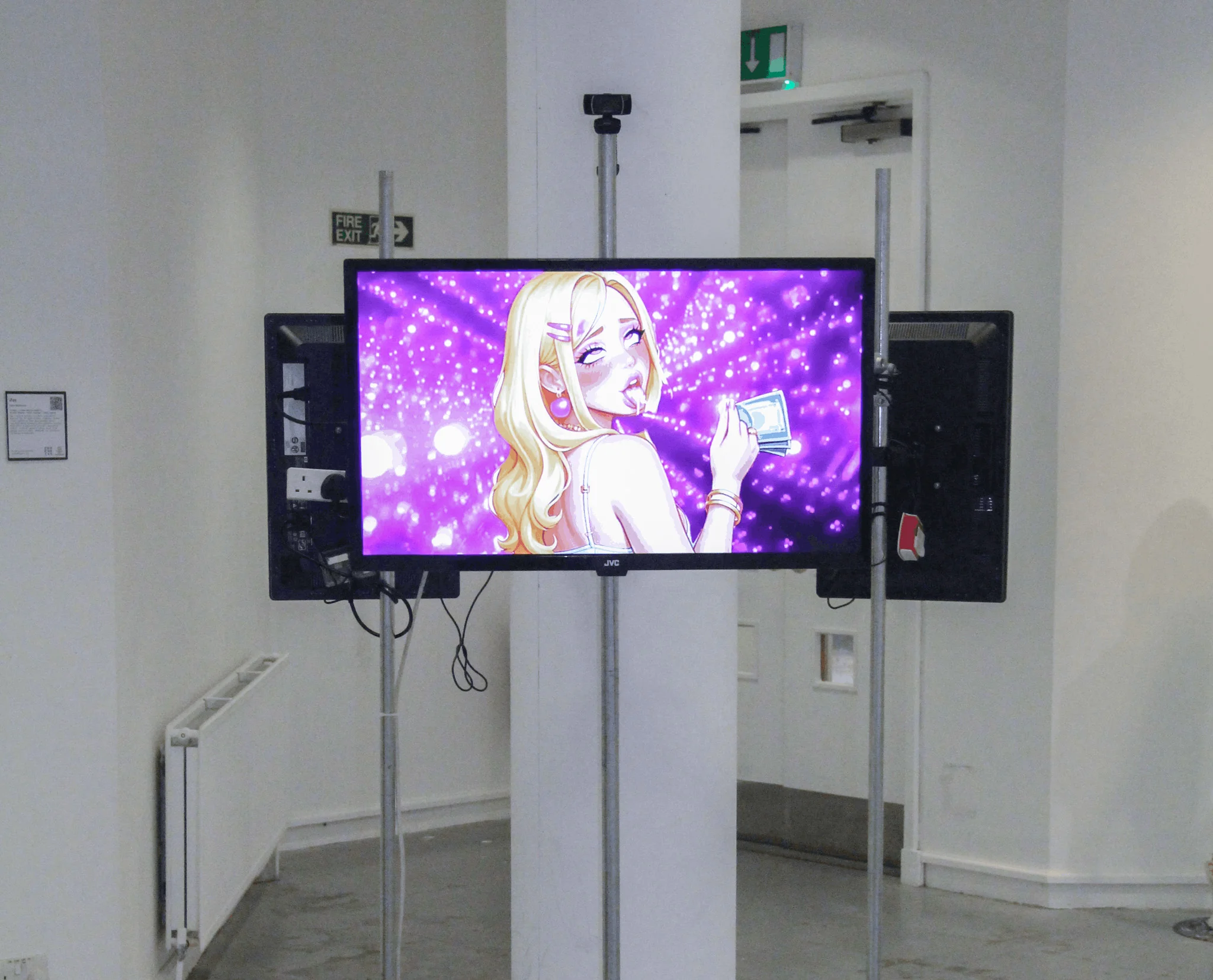 A screen held with metal bars, showing erotic material