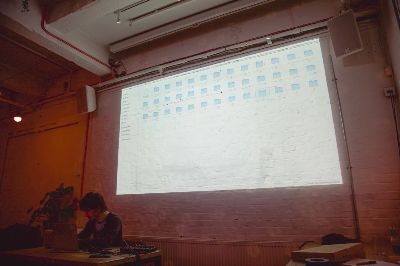 Person presenting at open projector event