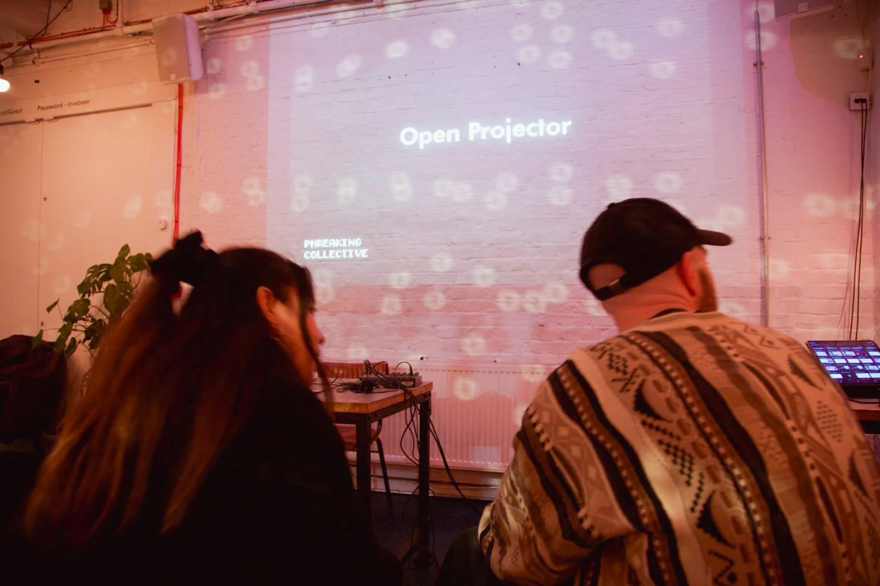 Person presenting at open projector event
