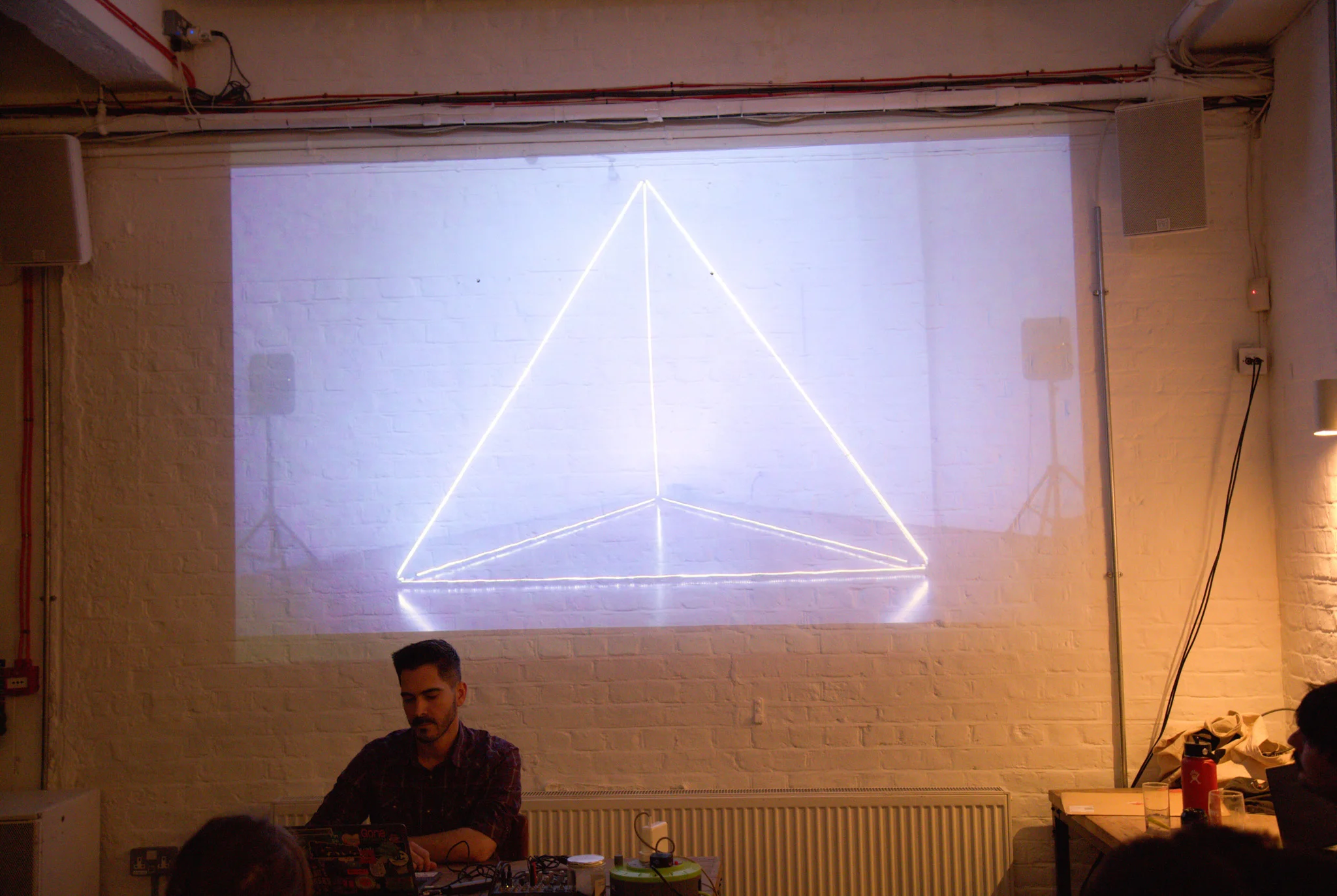 Person presenting at open projector event