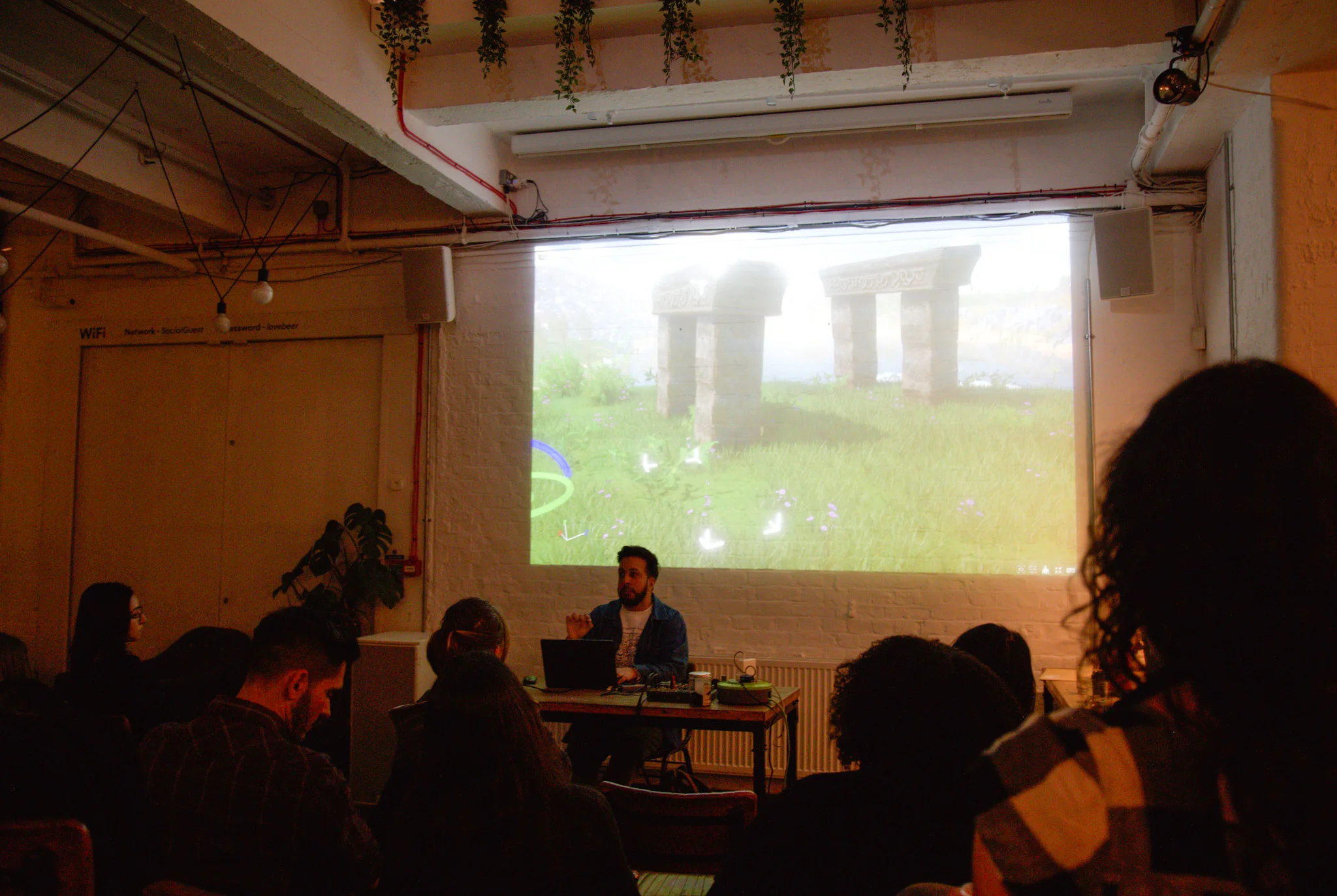 Person presenting at open projector event