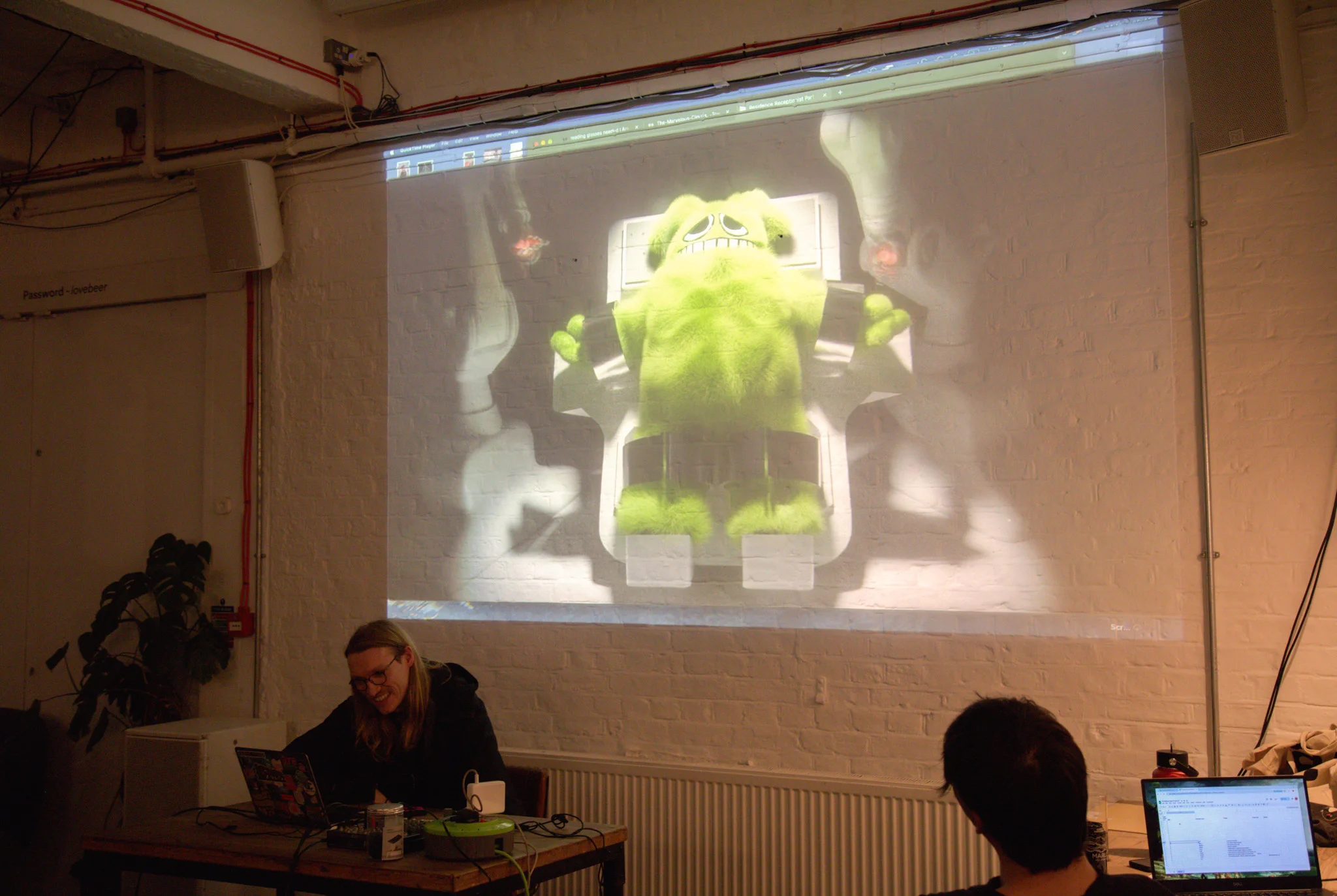Person presenting at open projector event
