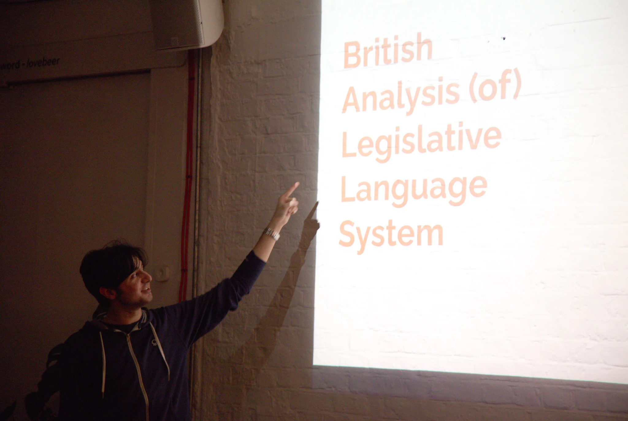 Person presenting at open projector event